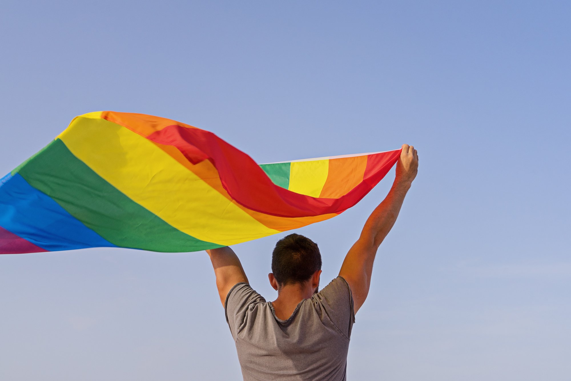 Man Holding LGBT Rainbow Flag